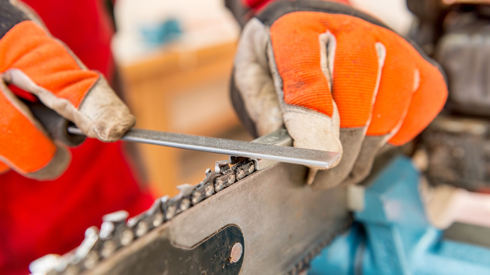 Close up of person wearing gloves using tools.