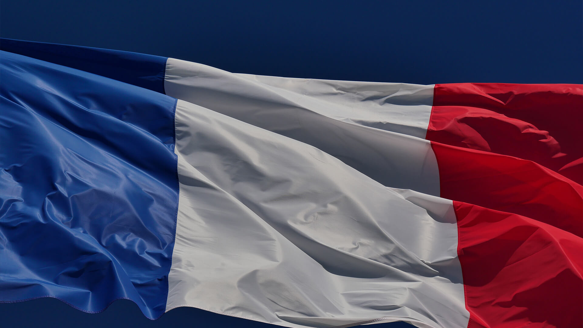 The French flag blowing in the wind.