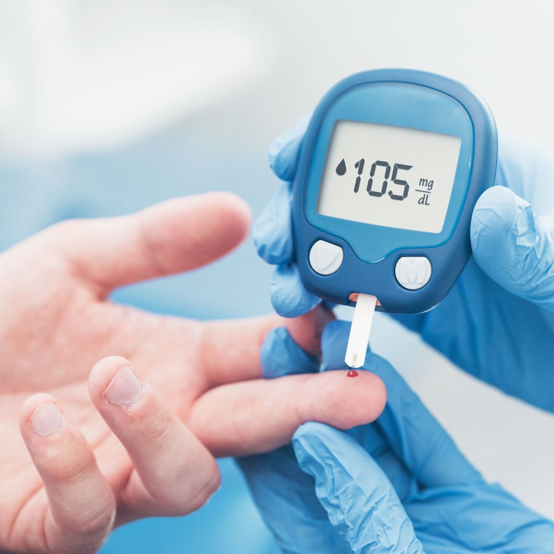 Person having bloods checked with a diabetes monitor