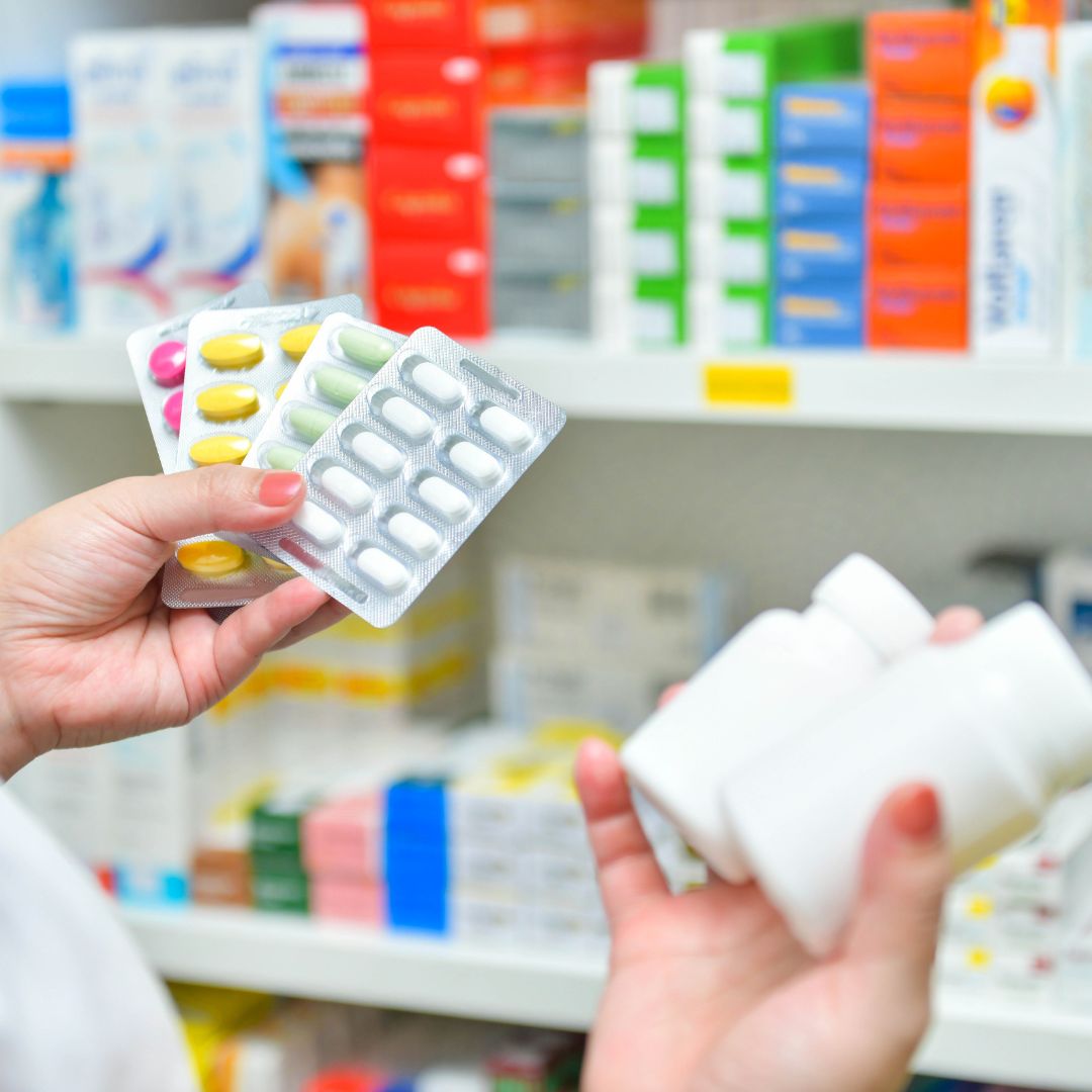 Pills and tables on black background