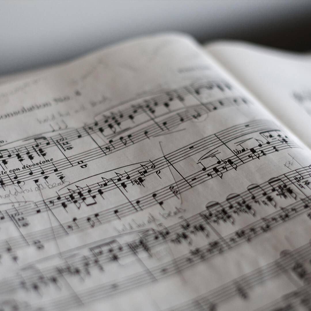 An open book of sheet music.