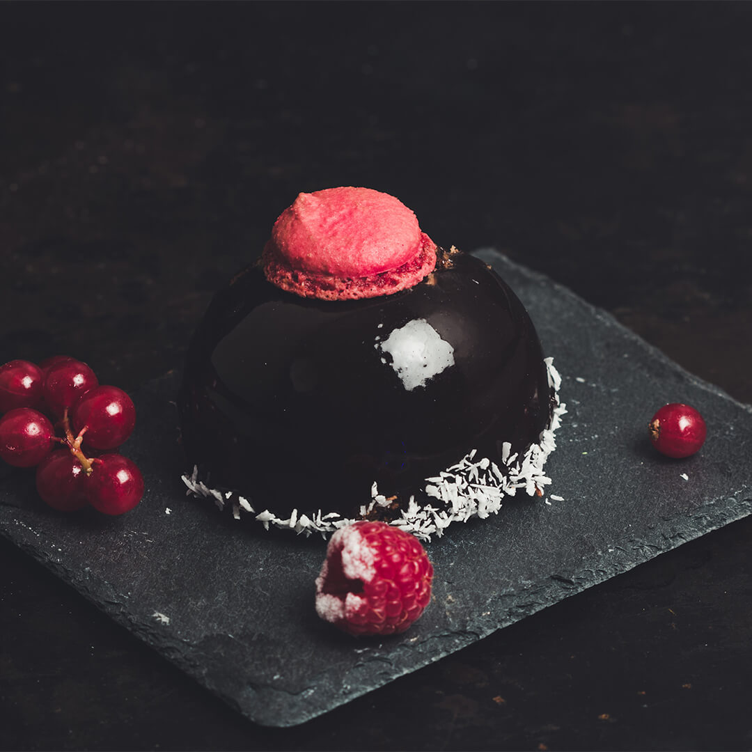 Chocolate dessert with fruit nicely displayed.