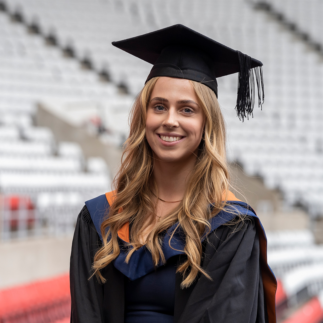 Student from University of Sunderland wearing mortar board and gown