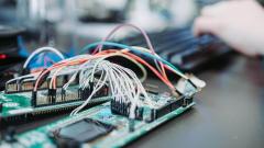 Close-up of a circuit board and wires on a table