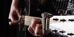 Close-up of someone playing an acoustic guitar