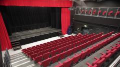 The Lubetkin Theatre auditorium red seating and stage with red curtains