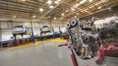 Inside The Technical Academy Campus motor vehicle workshop with a large engine part in the foreground