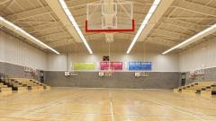 East Durham College sports hall with basketball nets visible and bleachers