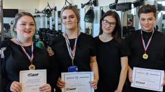 A group of four students holding their AHT Regional winners 2019 certificates