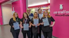 Six students stood, who were AHT Regional competition winners in group outside East Durham College salon