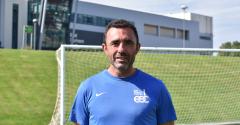 Gustavo stood in front of goal and East Durham College building