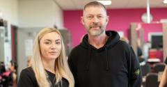 Blonde student and Lee Stafford stood looking at camera in hair salon