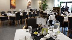 Inside East Durham College's Scene1 restaurant with tables set for dinner