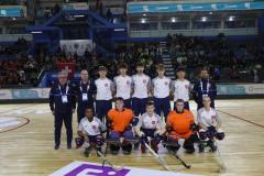 The Great Britain roller hockey team and coaches in a sports hall at the World Skate Games